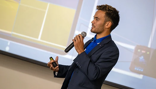 Aaron Osmond speaks at an event