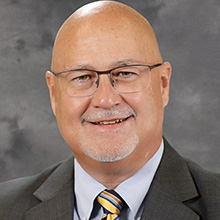 蒂姆·伯金克博士's headshot