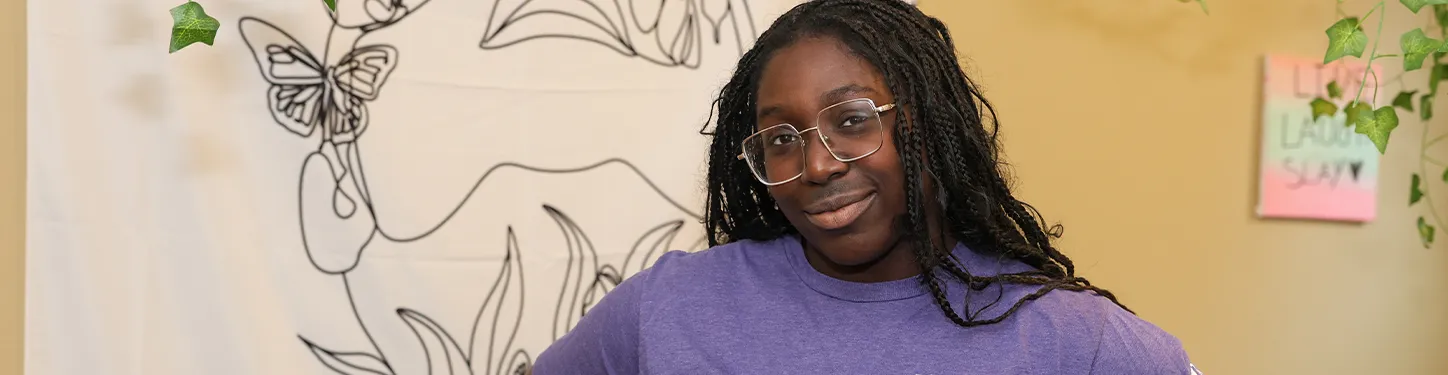 photo of a student in a purple t shirt