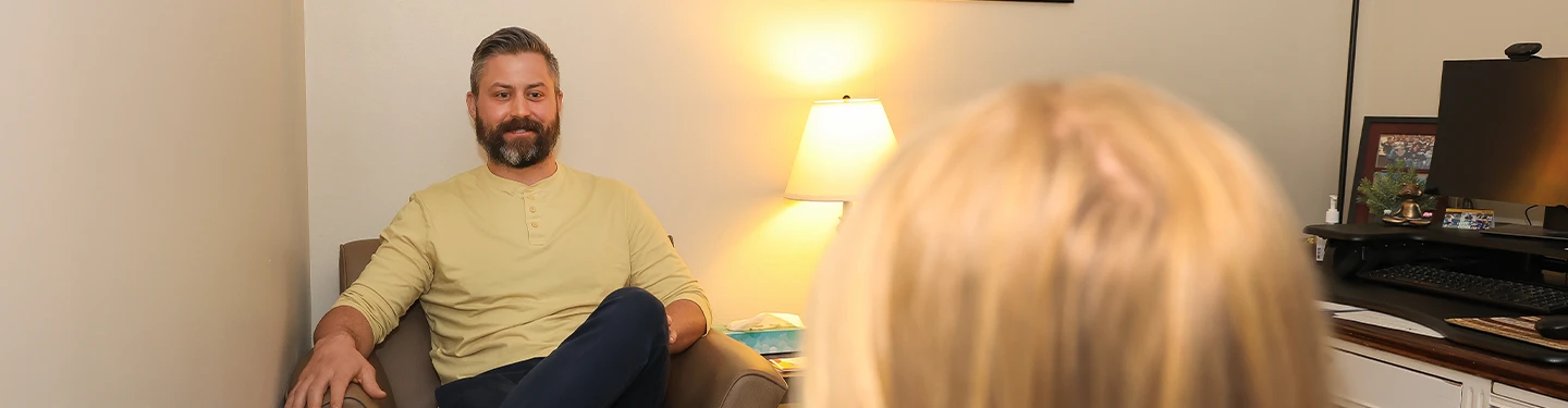 a counselor works with a student in a session