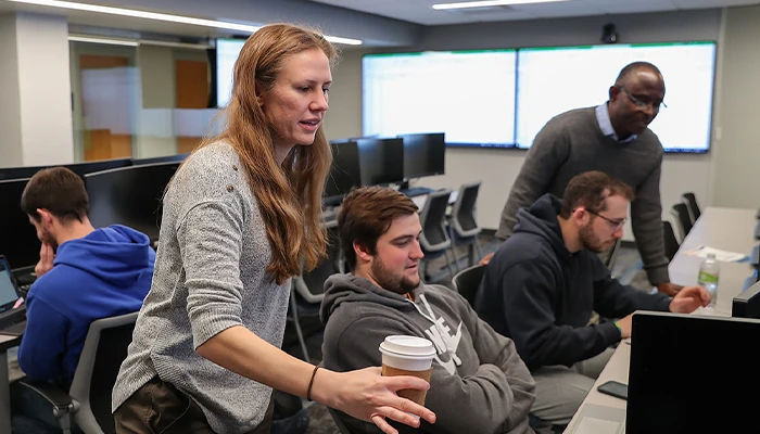 students and instructions work in the finance lab