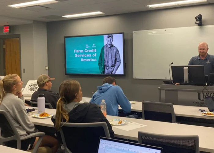 a guest speaker presents to students in the agribusiness club