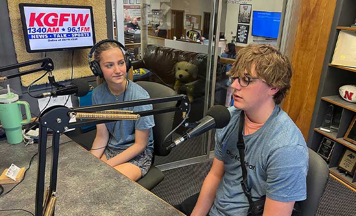 students are interviewed on the radio