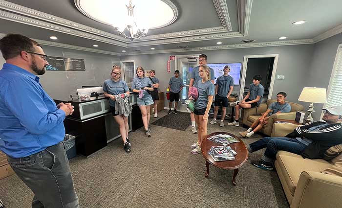 a group of students visits a business