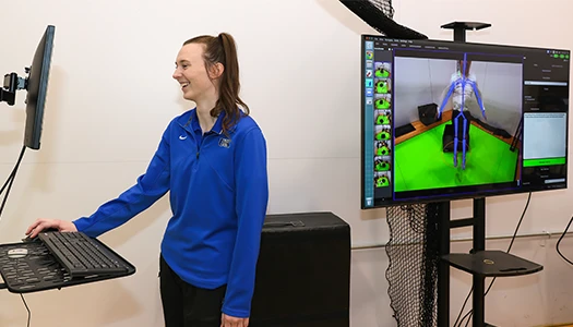 an athletic training student works with the dari motion system