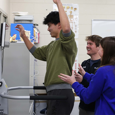 a student uses the fall risk assessment machine