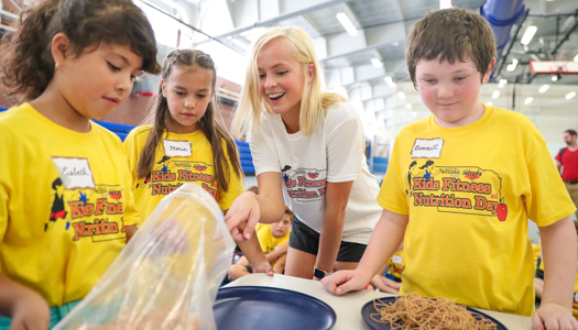 teachers and students in a gym