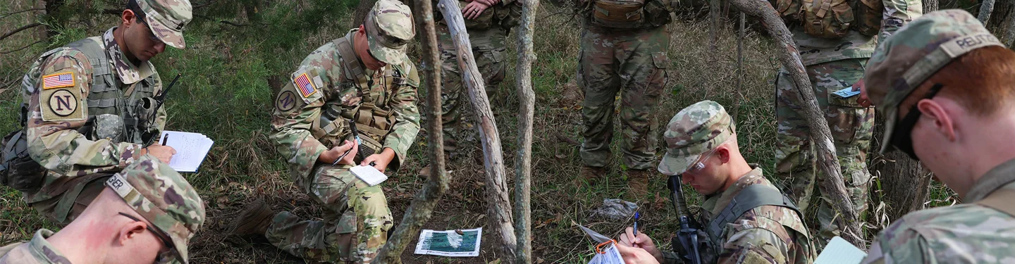 ROTC students read maps during training