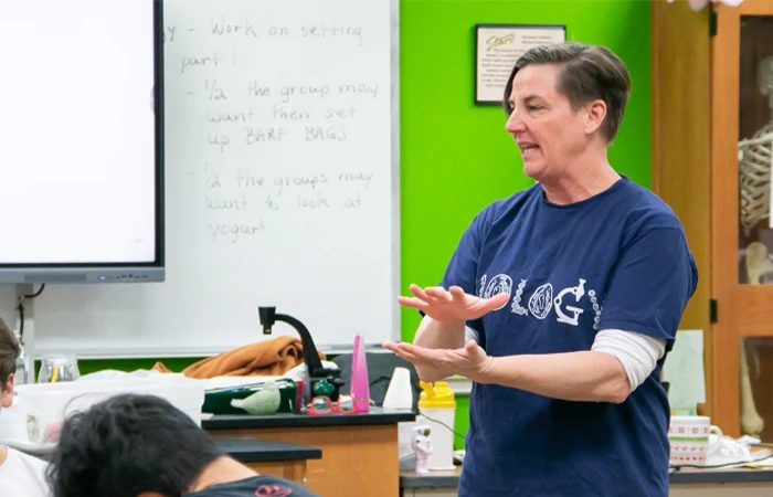 a teacher teaches a biology class