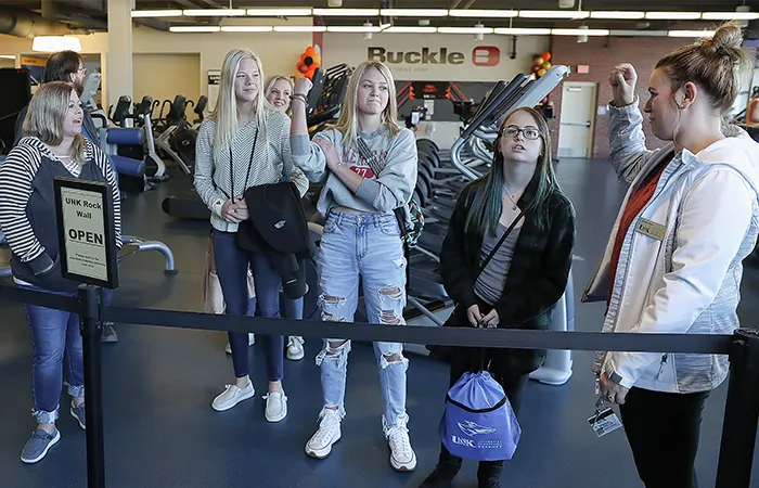 a tour guide shows a group the wellness center