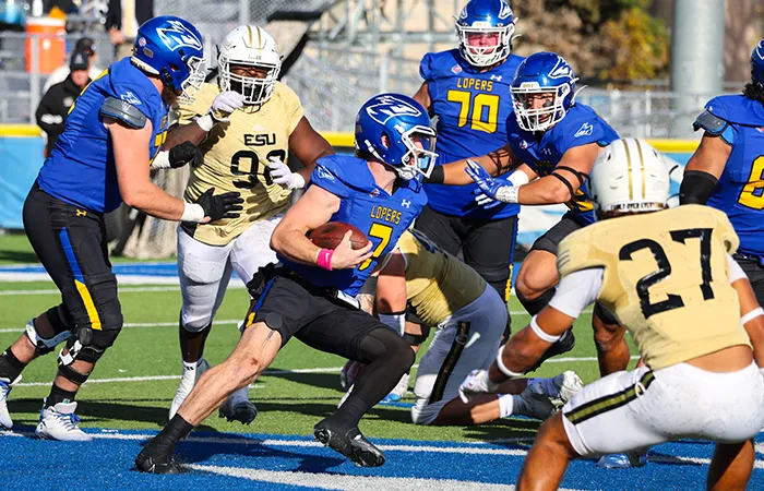 a unk football player runs the ball