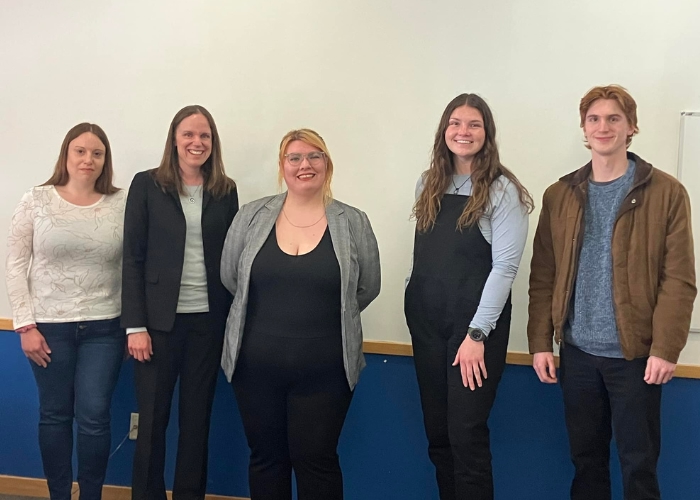 Group photo of students and professor.