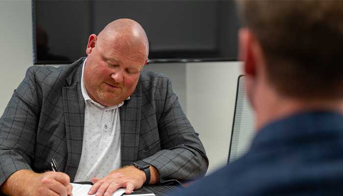 Tony talks with student