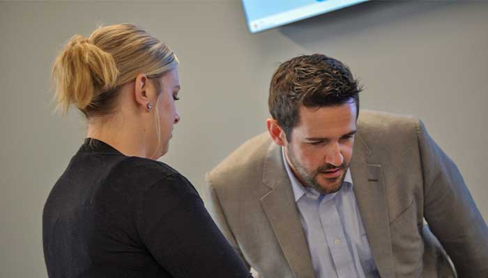 Dustin working with students