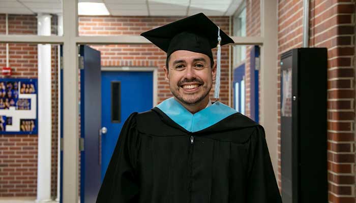John Kretlow in his graduation regalia during 太阳城娱乐官网's winter 2024 commencement ceremony.