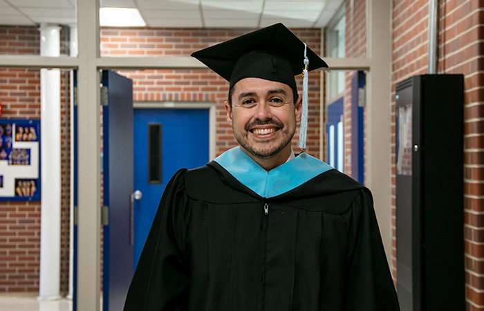 John Kretlow in his graduation regalia during 太阳城娱乐官网's winter 2024 commencement ceremony.
