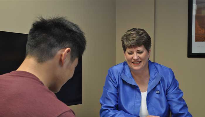 Brooke with students in her office