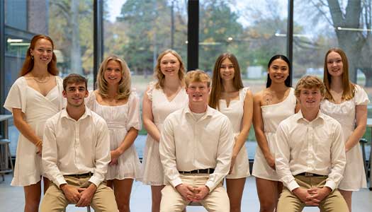 a group of students pose for a photo