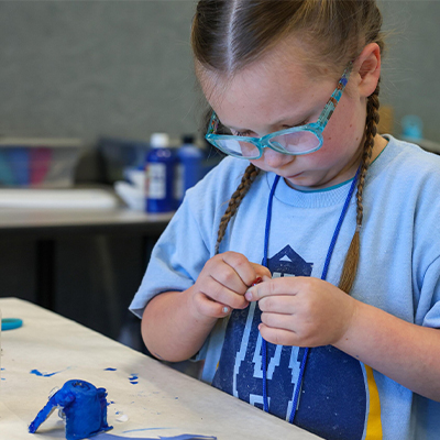 a student works at an activity in a classroom
