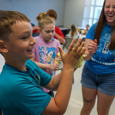 a student plays with slime during a workshop