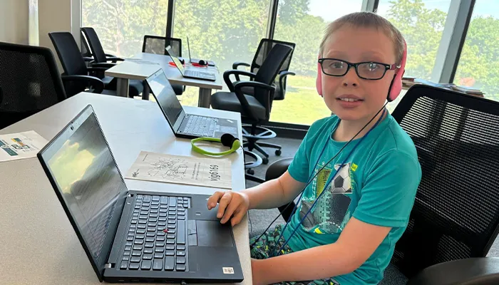a student works on an activity on a laptop