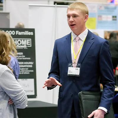 a student interacts with an employer at the career fair