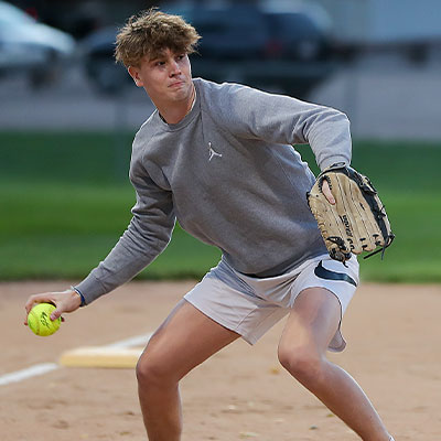 a player throws a softball