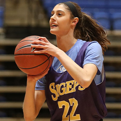 a player gets ready to pass during a basketball game