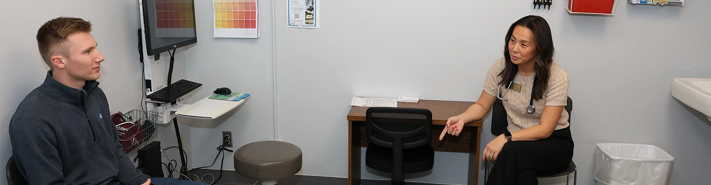 a student and nurse in exam room