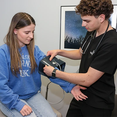 a student gets blood pressure taken