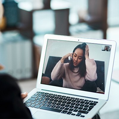 a person on a laptop screen