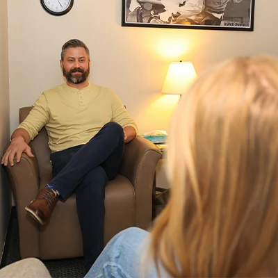 a counselor listens to a student