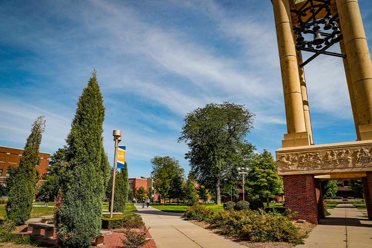 太阳城娱乐官网 bell tower and campus greens on a sunny day