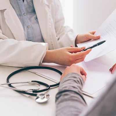 close up of a doctor speaking with a patient
