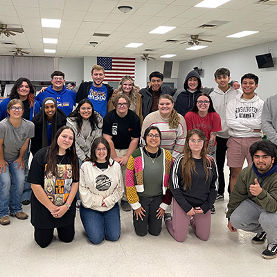 students pose for a large group photo