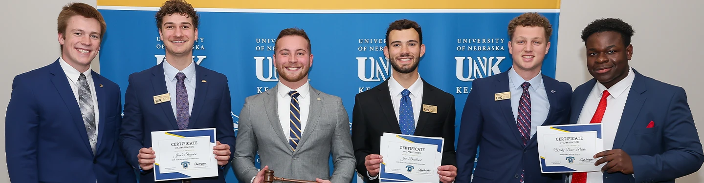 a group of student government members pose for a photo at inauguration  